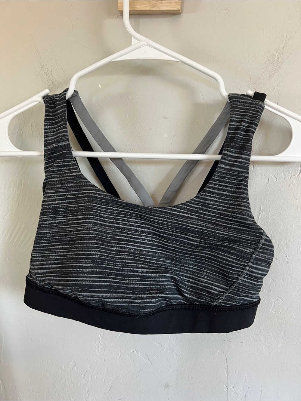 Lululemon grey and black sports bra. Faded logo on back, see picture